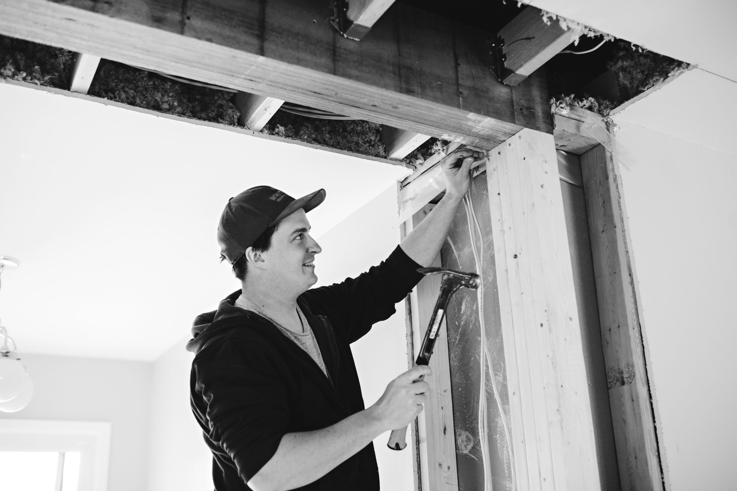 Carpenter, installing a beam